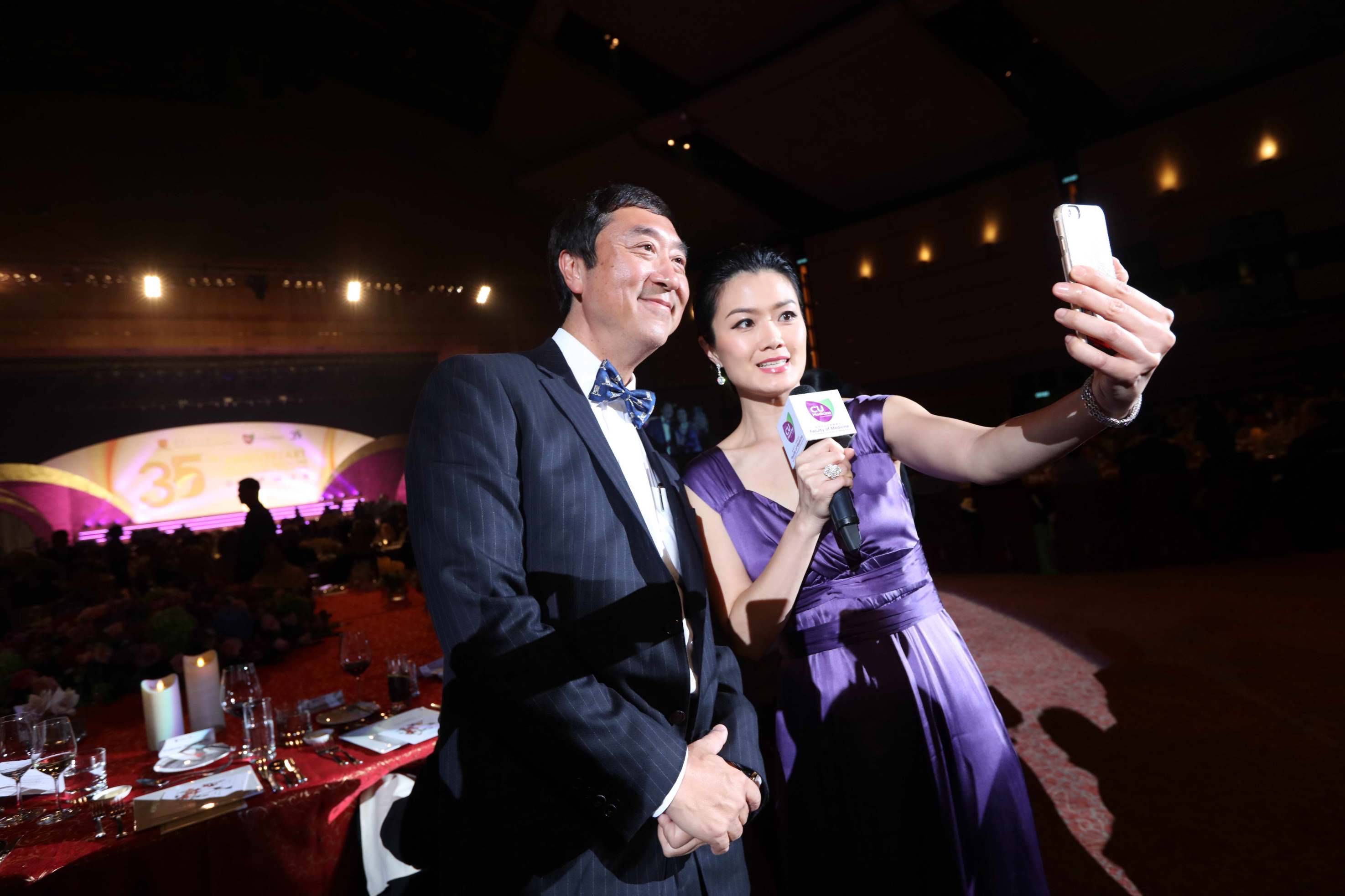 Vice-Chancellor Prof. Joseph SUNG and host of dinner Ms. Akina FONG take a mobile selfie.